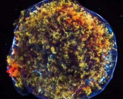 Tycho Supernova Remnant: The supersonic expansion of the exploded star brought "a shock wave moving outward into the surrounding interstellar gas, and another, reverse shock wave moving back into the expanding stellar debris,” NASA reports. Image: NASA.
