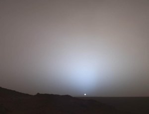 The Mars Rover Spirit took this view of a sunset over the rim of Gusev Crater, about 80 kilometers (50 miles) away. It looks much like a sunset on Earth—a reminder that other worlds can seem eerily familiar. --NASA image.