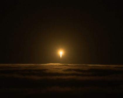 A rocket with the InSight lander punches through the clouds.